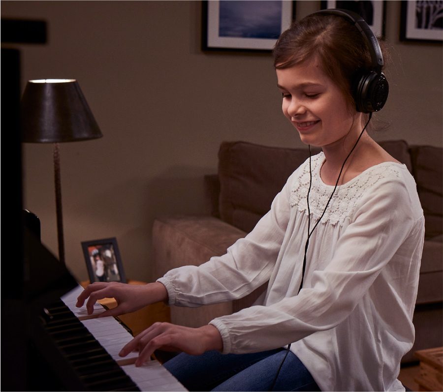 upright piano with headphones